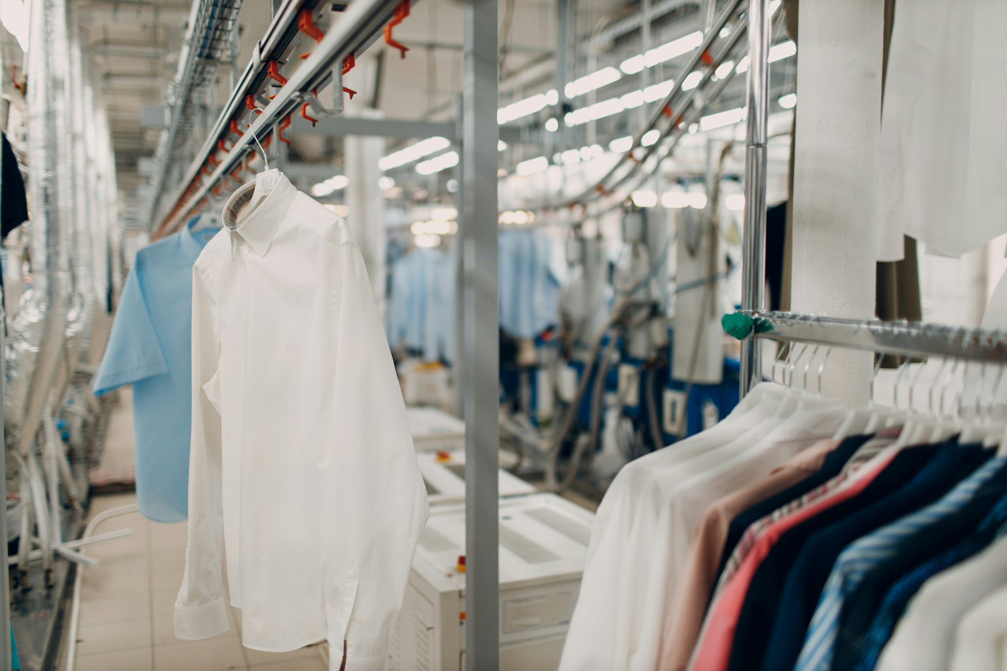 Dry cleaning clothes. Clean cloth chemical process. Laundry industrial dry-cleaning