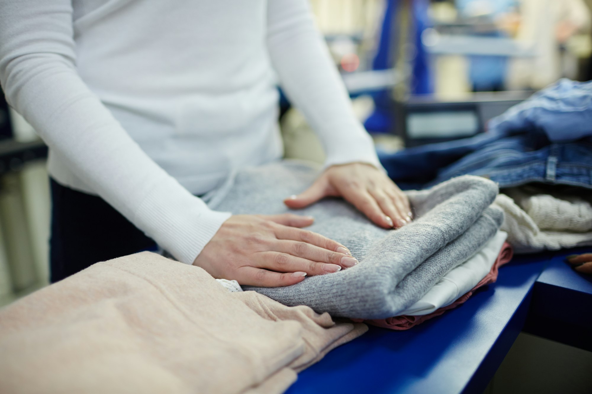 Working in dry-cleaning shop